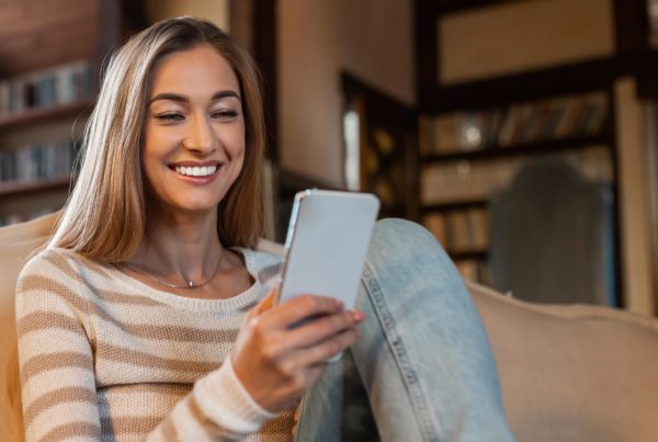 Woman viewing hybrid nonprofit event on phone
