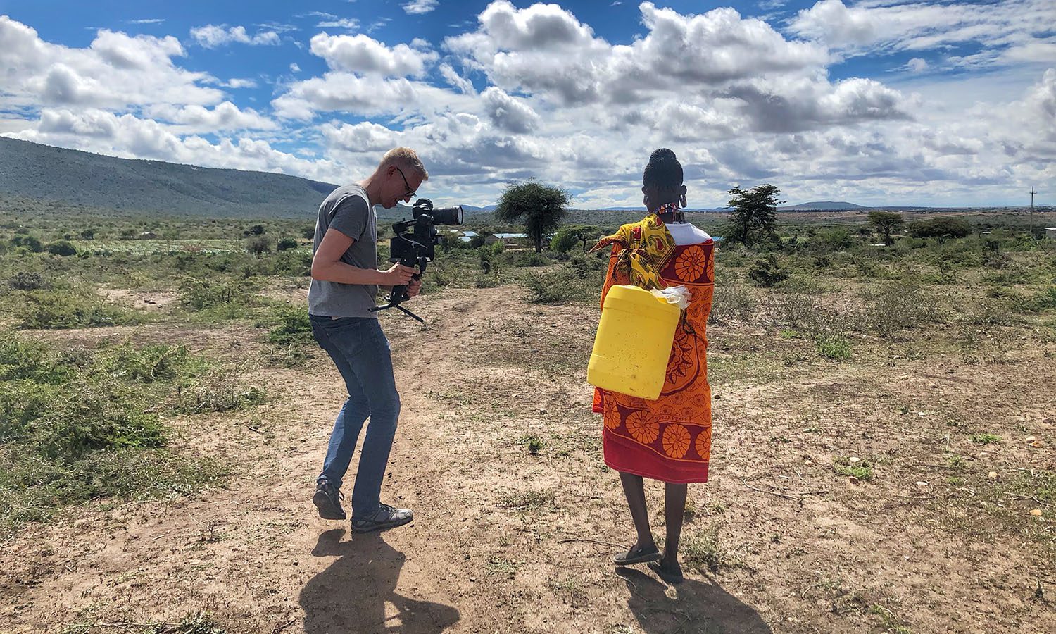 Filmmaker captures African woman walking in field